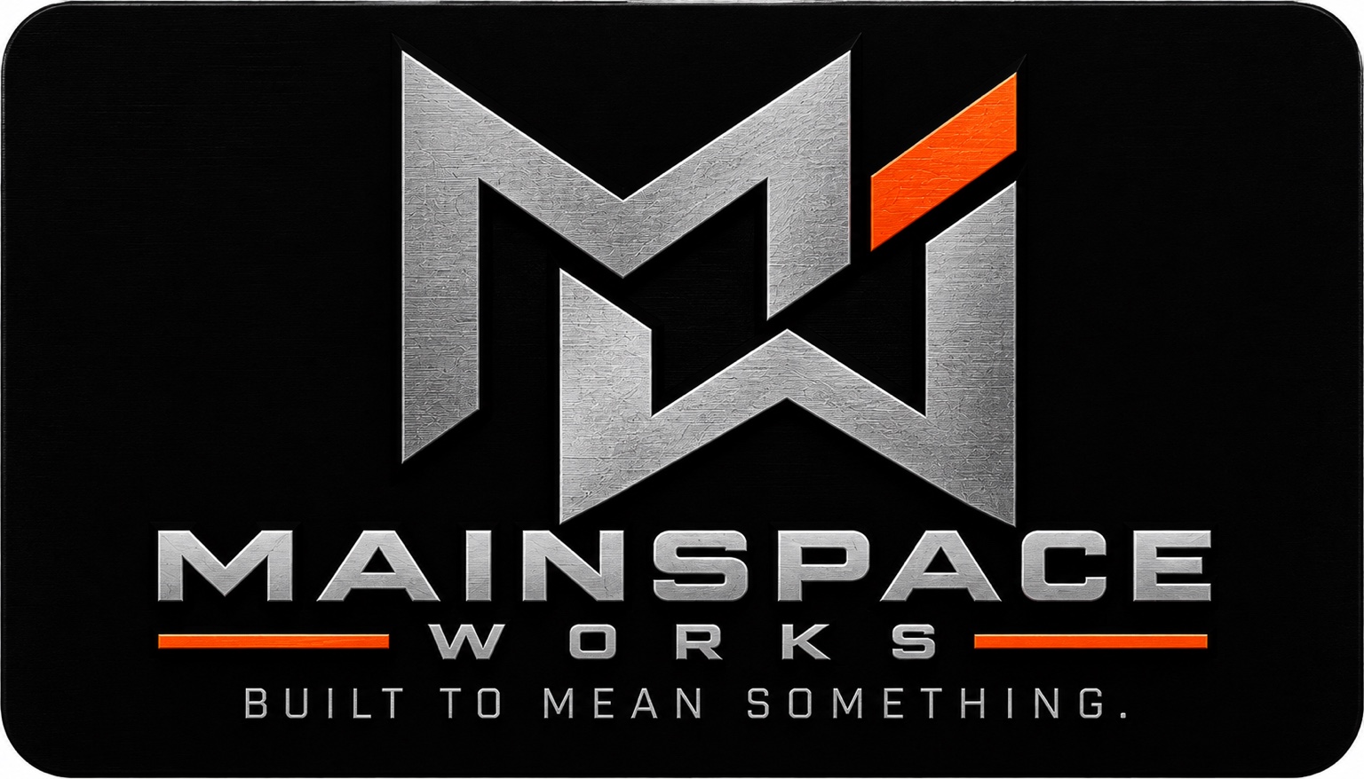 Mainspace Works metallic silver and orange logo with Built to Mean Something tagline